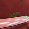 RED PLEATHER CHAIR W/METAL LEGS