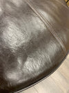 BROWN LEATHER ROUND OTTOMAN W/WOOD BASE