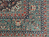 GREEN/RED ORNATE RUG