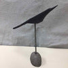 WOOD BIRD ON STONE STAND