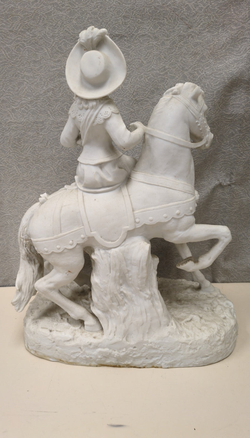 WOMAN RIDING HORSE SCULPTURE