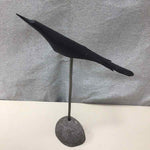 WOOD BIRD ON STONE STAND