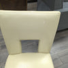 2 CREAM FAUX LEATHER CHAIRS