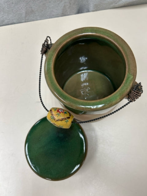 GREEN/TAN CERAMIC JAR W/HANDLE