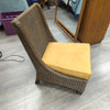 BROWN WICKER ARMLESS CHAIR W/CUSHION