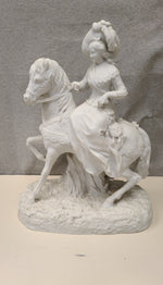 WOMAN RIDING HORSE SCULPTURE