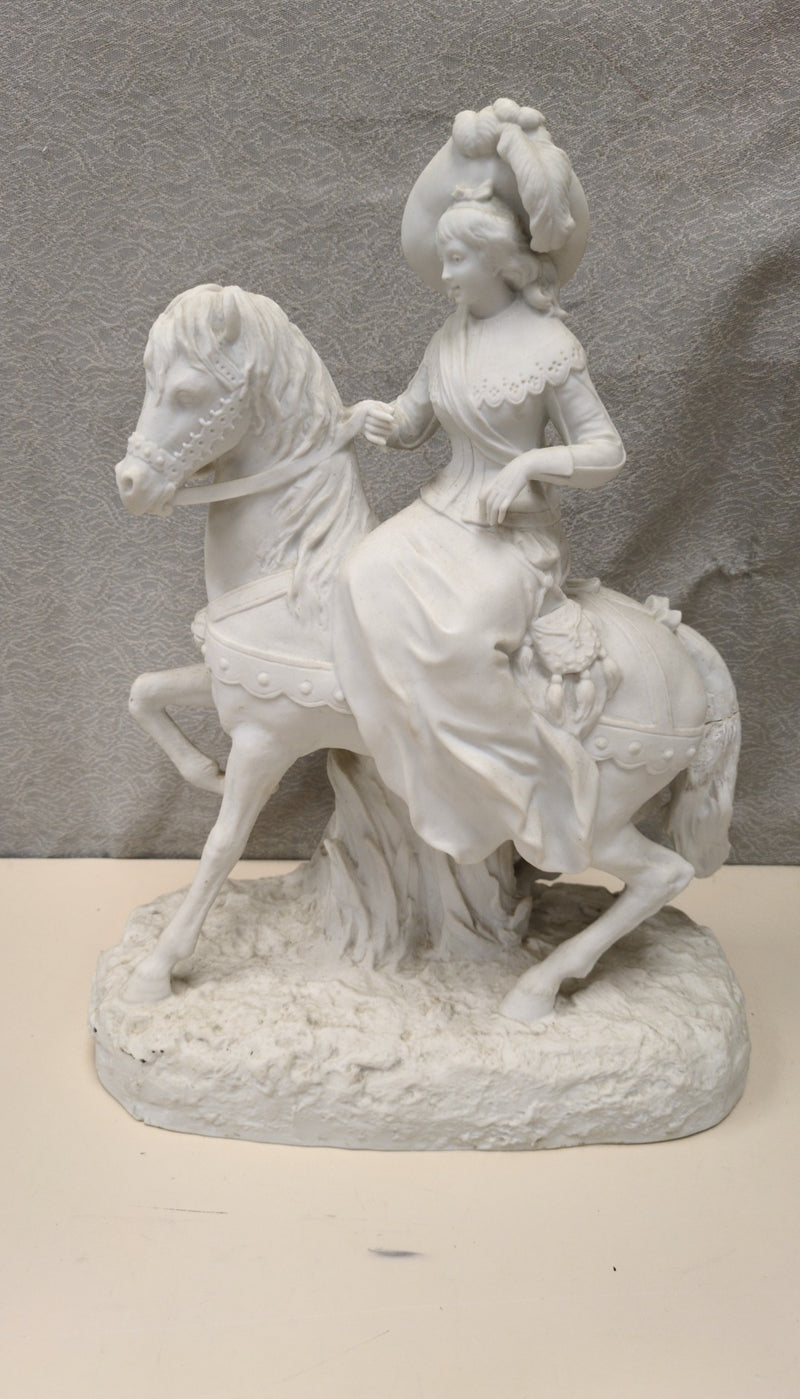 WOMAN RIDING HORSE SCULPTURE