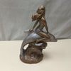 WOMAN RIDING DOLPHIN STATUE