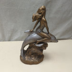 WOMAN RIDING DOLPHIN STATUE