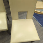 2 CREAM FAUX LEATHER CHAIRS