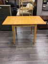 LIGHT BROWN DINING TABLE WITH 2 DROP LEAFS