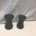 2 BLACK CANDLE HOLDERS