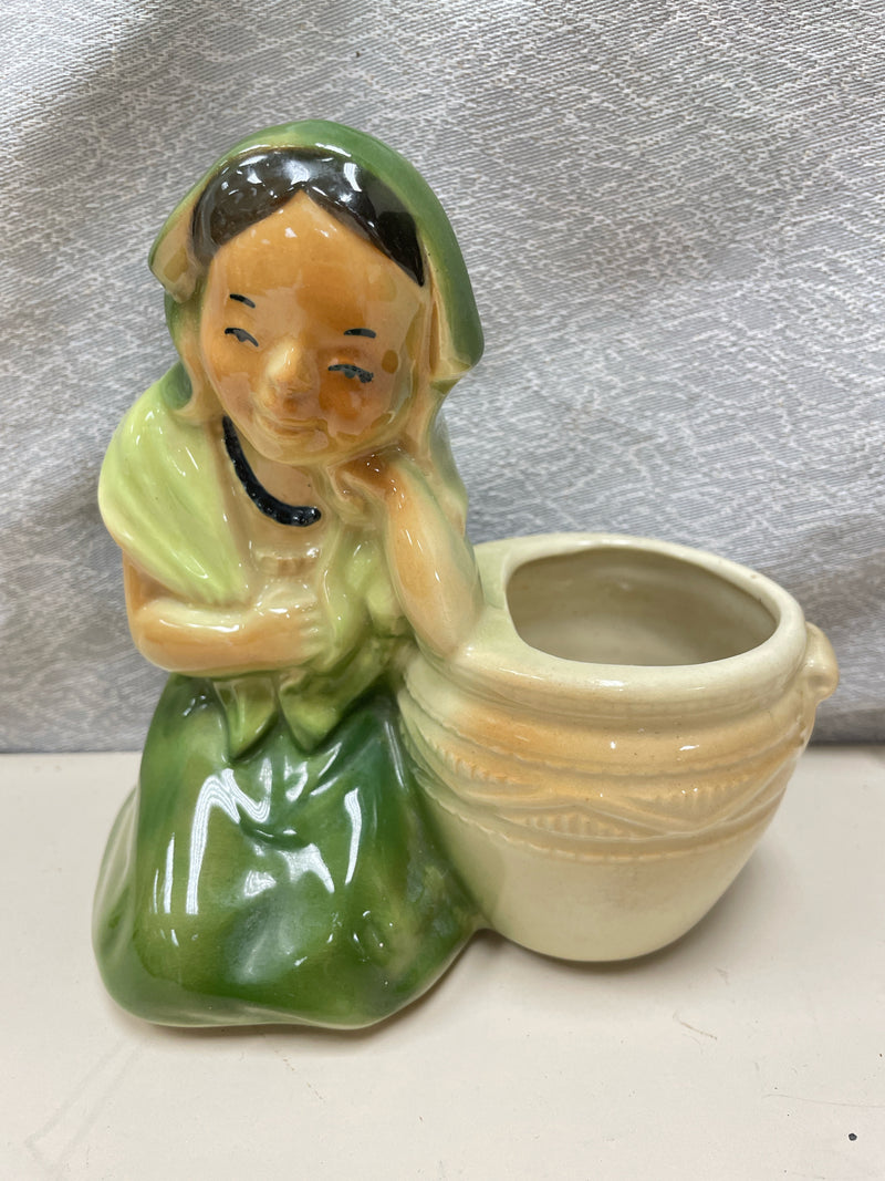WOMAN SITTING NEXT TO PLANTER SHAWNEE SCULPTURE