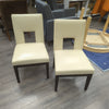 2 CREAM FAUX LEATHER CHAIRS