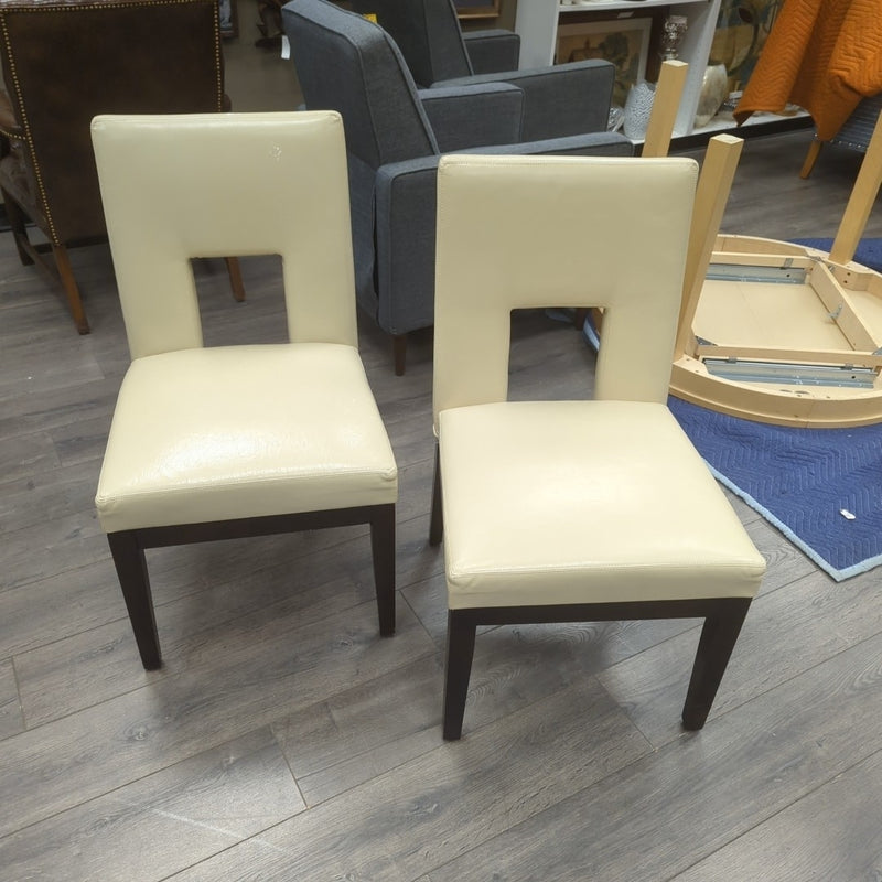 2 CREAM FAUX LEATHER CHAIRS