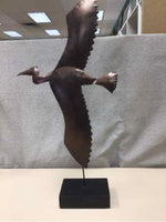 BROWN METAL BIRD ON WOOD STAND