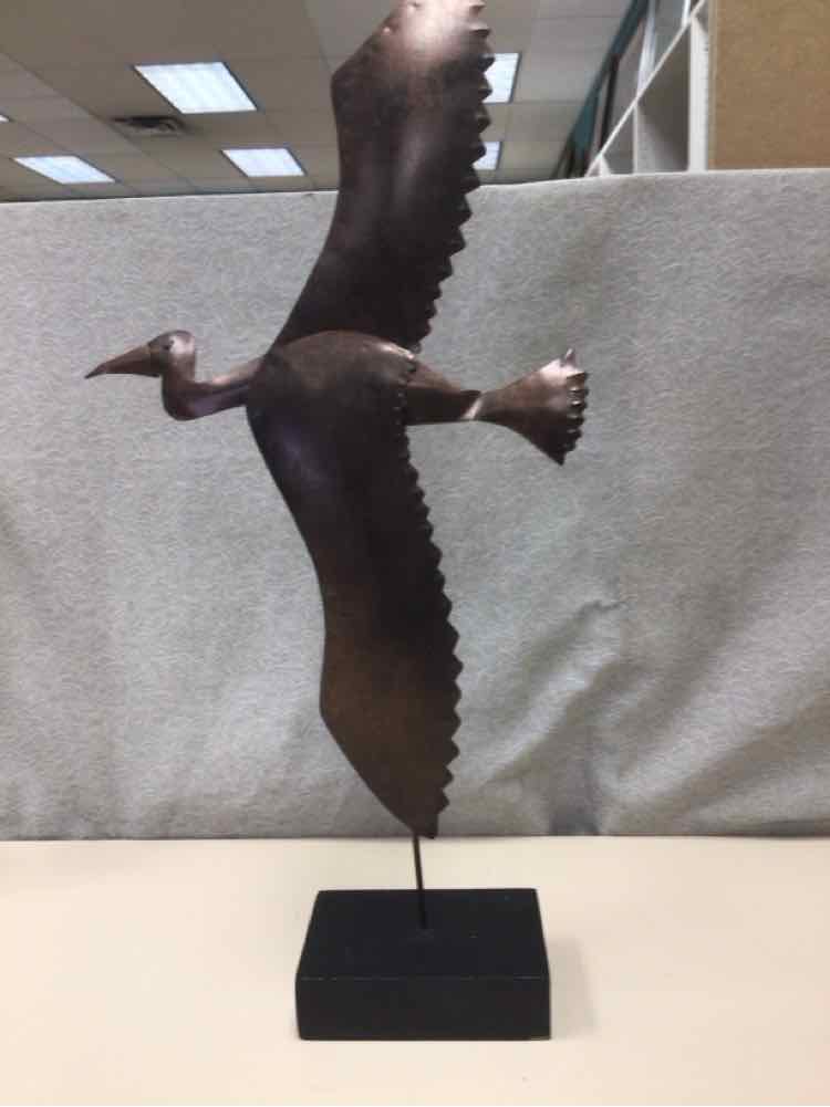BROWN METAL BIRD ON WOOD STAND