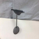 WOOD BIRD ON STONE STAND