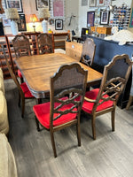 CARVED TABLE W/6 RATTAN CHAIRS W/RED UPHOL