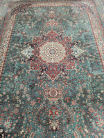 GREEN/RED ORNATE RUG