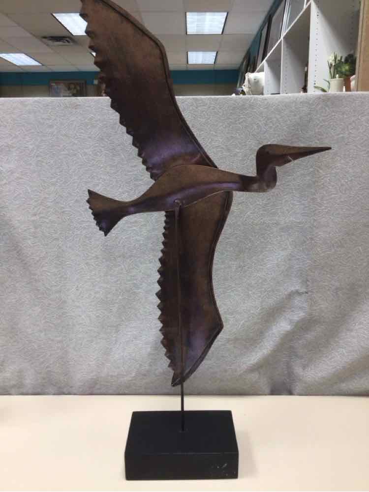 BROWN METAL BIRD ON WOOD STAND