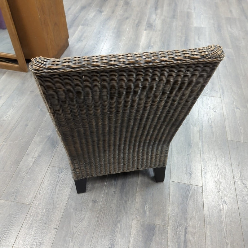 BROWN WICKER ARMLESS CHAIR W/CUSHION