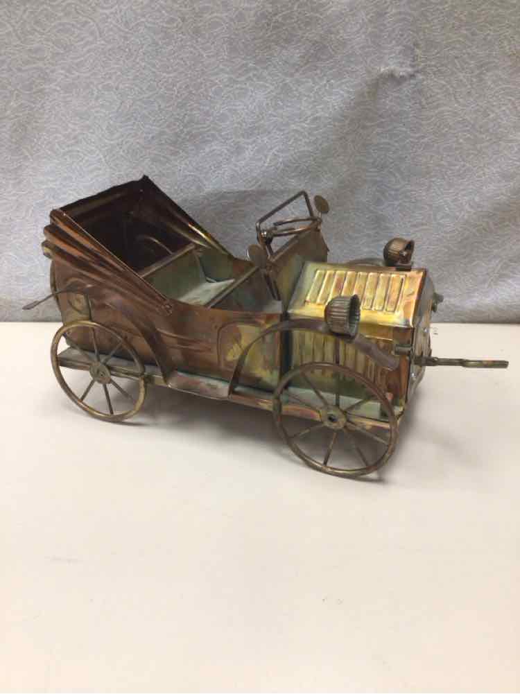 OLD METAL CAR SCULPTURE
