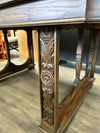 CARVED TABLE W/6 RATTAN CHAIRS W/RED UPHOL