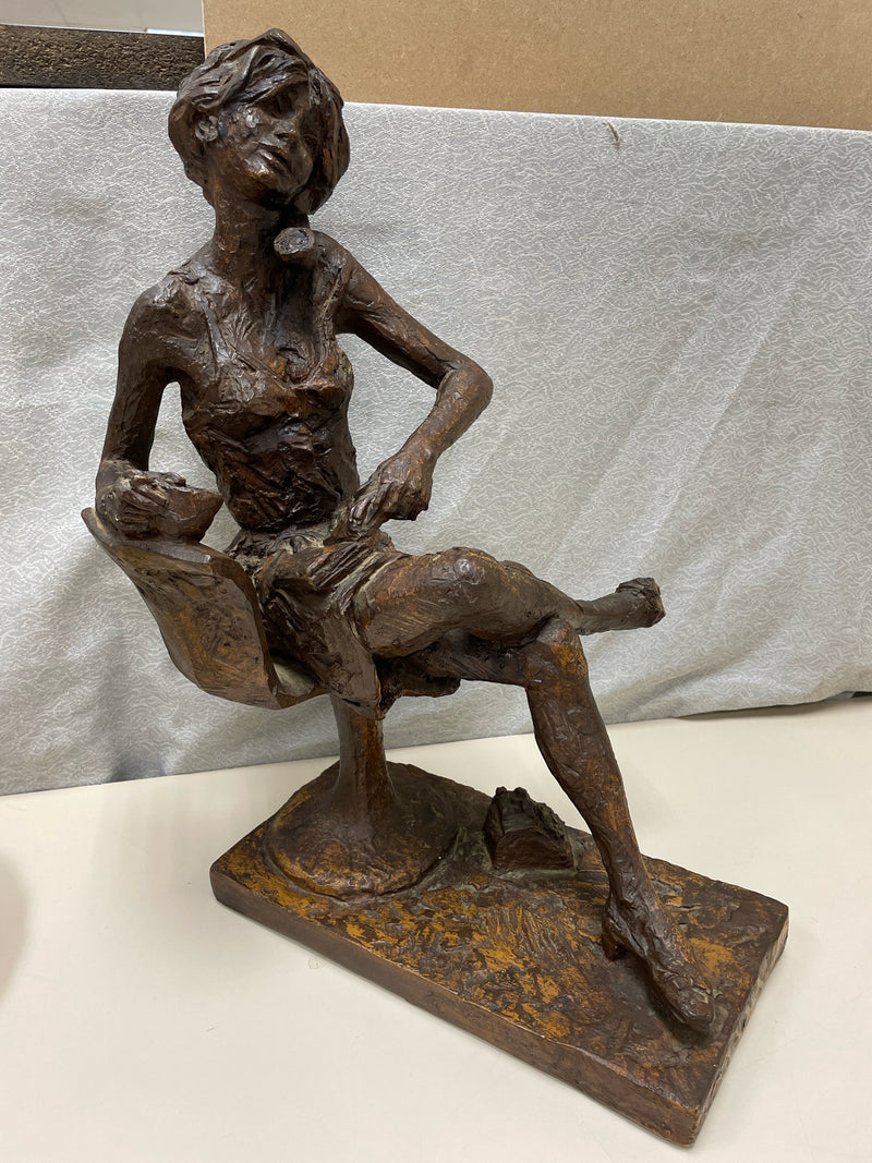 IRON WOMAN ON TELEPHONE STATUE