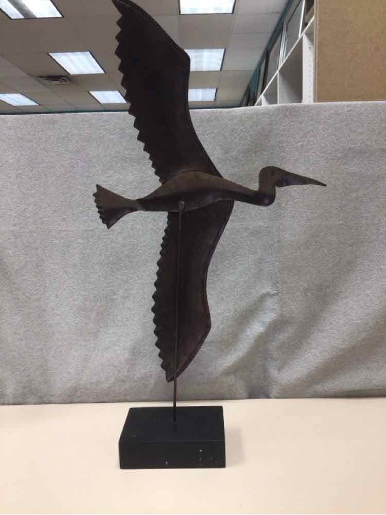 BROWN METAL BIRD ON WOOD STAND
