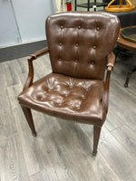 BROWN LEATHER BOLSTERED ARMCHAIR