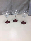 CLEAR GLASS WINE GLASSES W/RED BOTTOM
