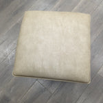 BEIGE FAUX LEATHER OTTOMAN