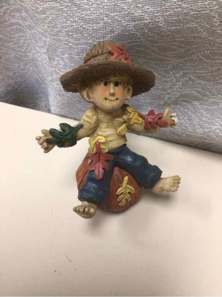 BOY ON PUMPKIN