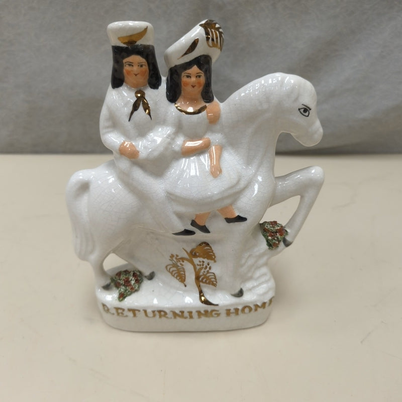 MAN WOMAN ON CERAMIC HORSE FIGURINE