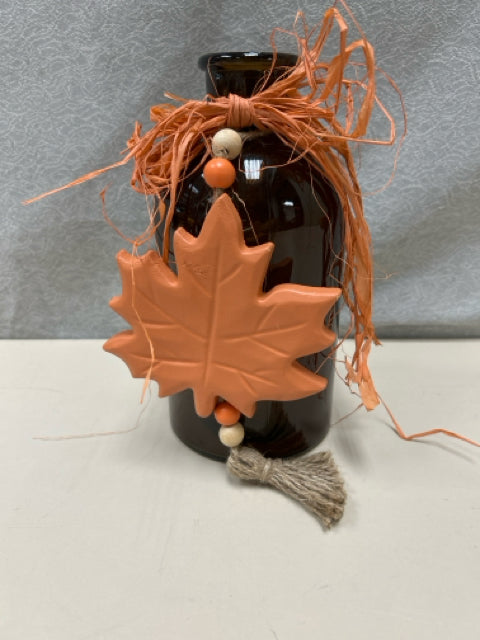 AMBER JAR W/MAPLE LEAF ORNAMENT