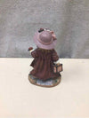 GIRL HOLDING TRUNK FIGURINE