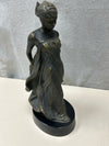 IRON WOMAN IN DRESS STATUE