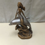 WOMAN RIDING DOLPHIN STATUE