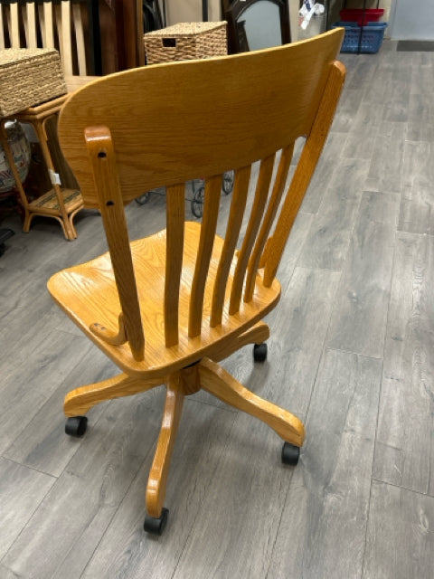 SOLID OAK DESK CHAIR ON WHEELS
